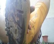 Lick my yellow boots completely dirty with green mud while I'm in the garden from foot lik